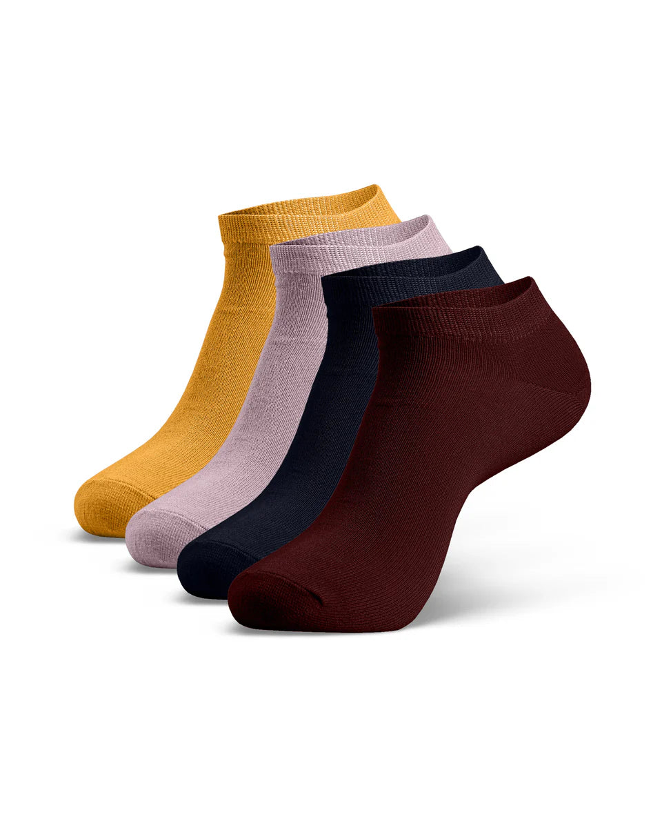 Four pairs of ankle socks in mustard, pink, navy, and brown on a white background