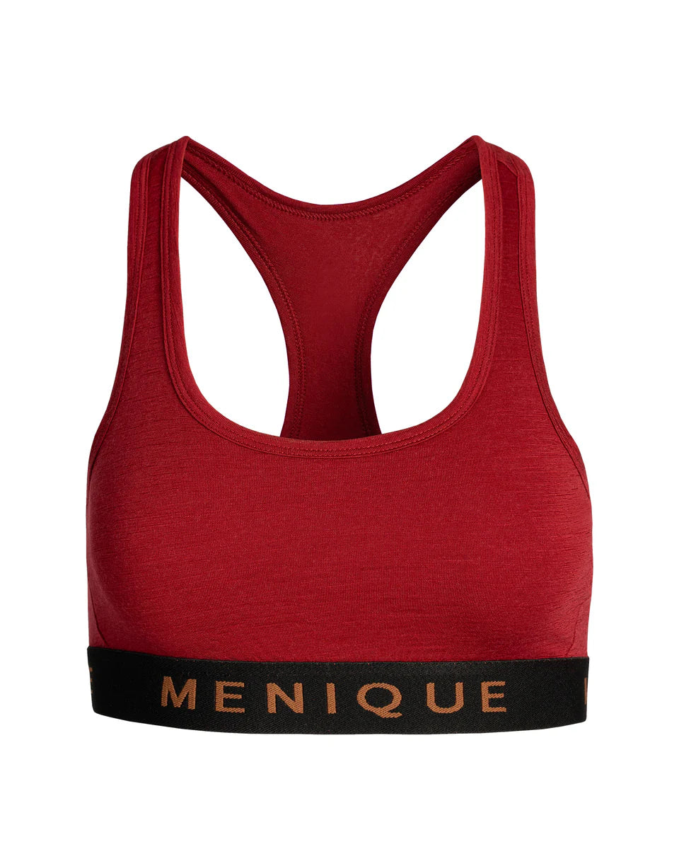 Red sports bra with 'Menique' branding on a white background