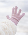 Pink knitted glove on a white background