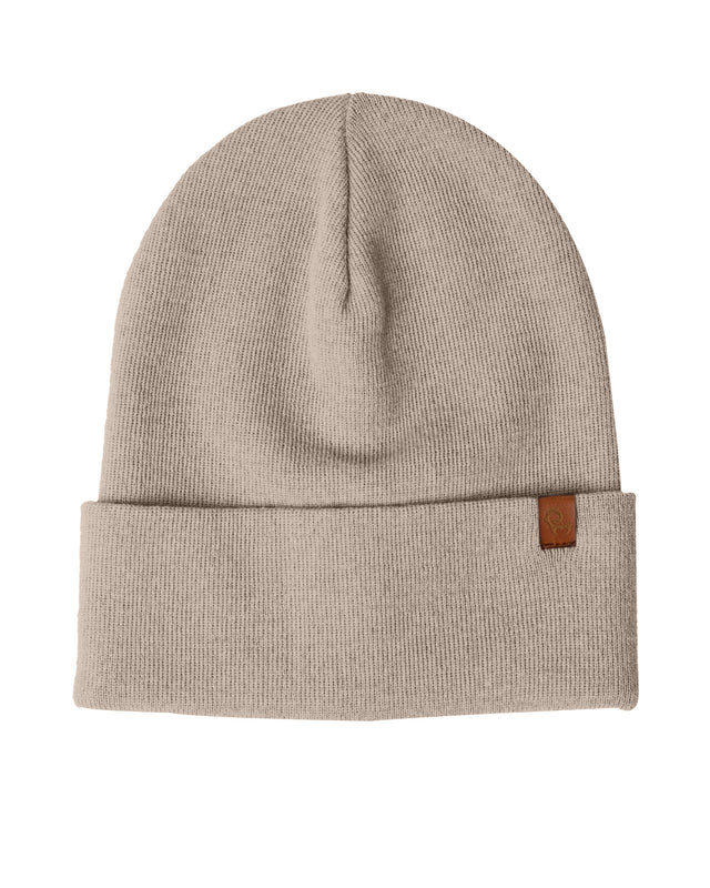 Beige beanie with a brown label on a white background