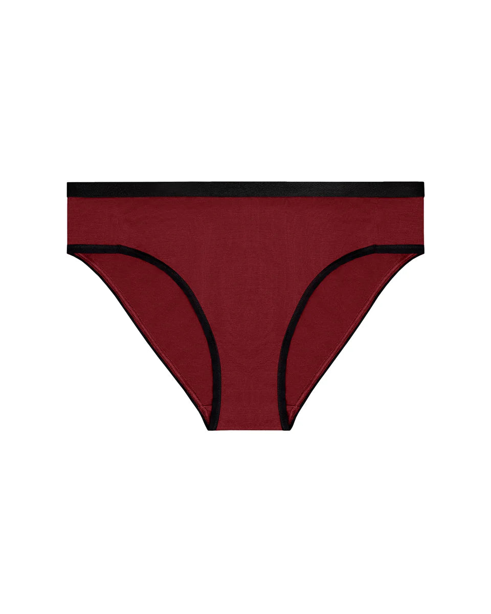 Wine red women's underwear with black trim on a white background